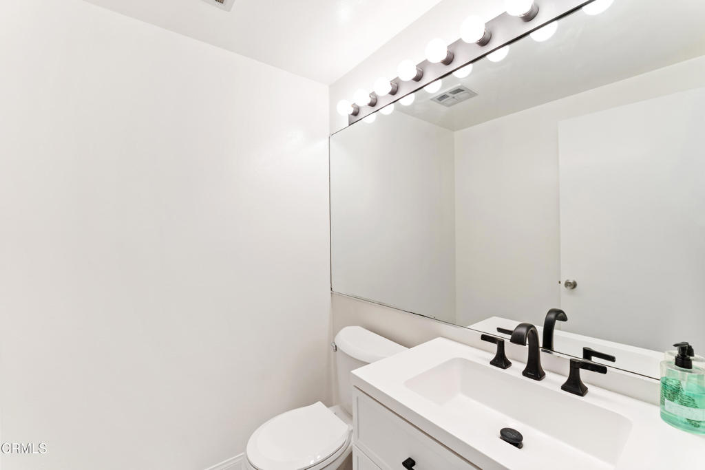 4320 Meridian Avenue Oxnard, CA 93035 - Photo 16 of 31 a bathroom with a sink and a toilet