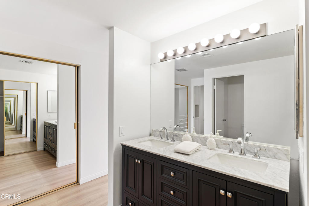 4320 Meridian Avenue Oxnard, CA 93035 - Photo 22 of 31 a bathroom with a double vanity sink and mirror
