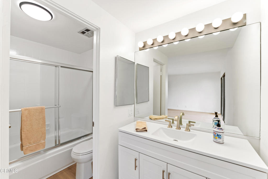4320 Meridian Avenue Oxnard, CA 93035 - Photo 27 of 31 a bathroom with a sink and mirror with toilet