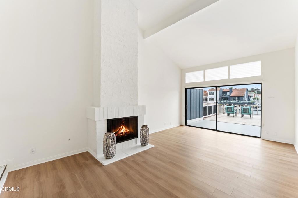 4320 Meridian Avenue Oxnard, CA 93035 - Photo 4 of 31 a view of empty room with wooden floor and fireplace