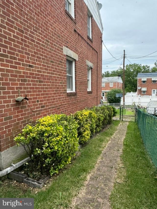 1619 Inverness Avenue Baltimore, MD 21230 - Photo 4 of 30 a brick building with a yard