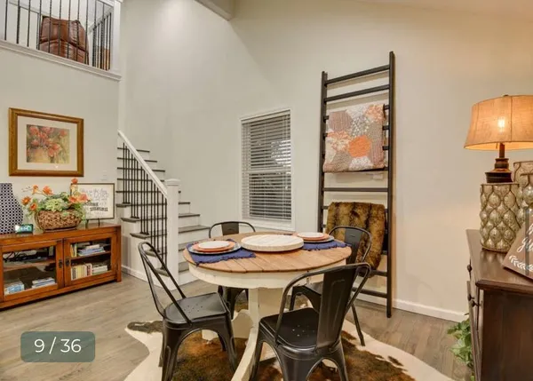 a bathroom with a granite countertop toilet sink and mirror