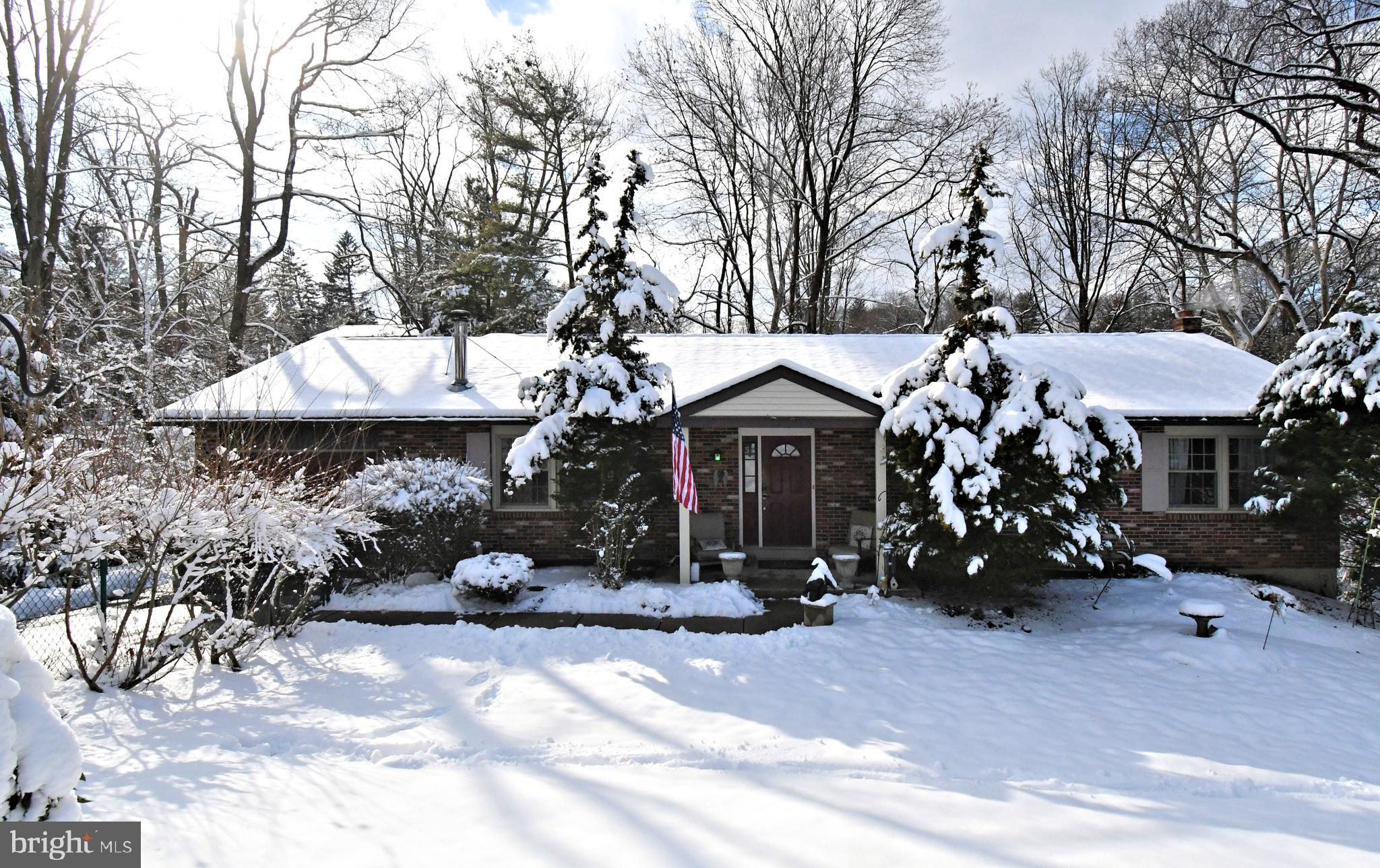 1113 Clark Road Wyndmoor, PA 19038 - Photo 1 of 68 a view of a white house with a yard and a tree