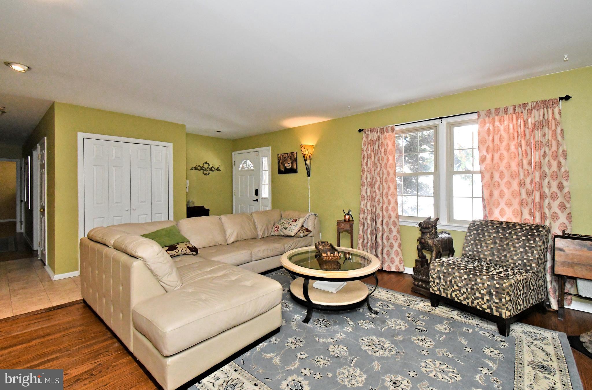 1113 Clark Road Wyndmoor, PA 19038 - Photo 18 of 68 a living room with furniture and a large window