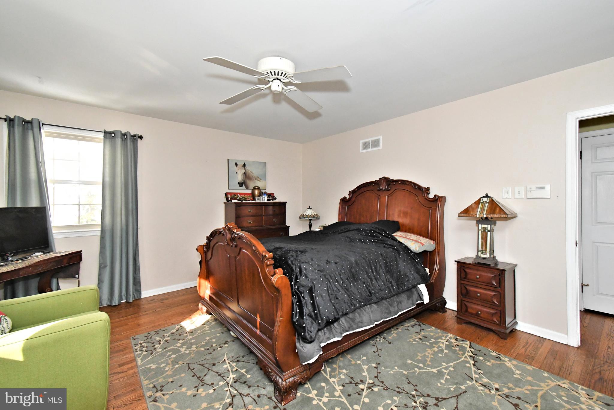 1113 Clark Road Wyndmoor, PA 19038 - Photo 30 of 68 a bedroom with a bed and wooden floor