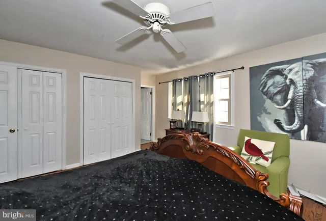 a workspace with furniture and wall paintings