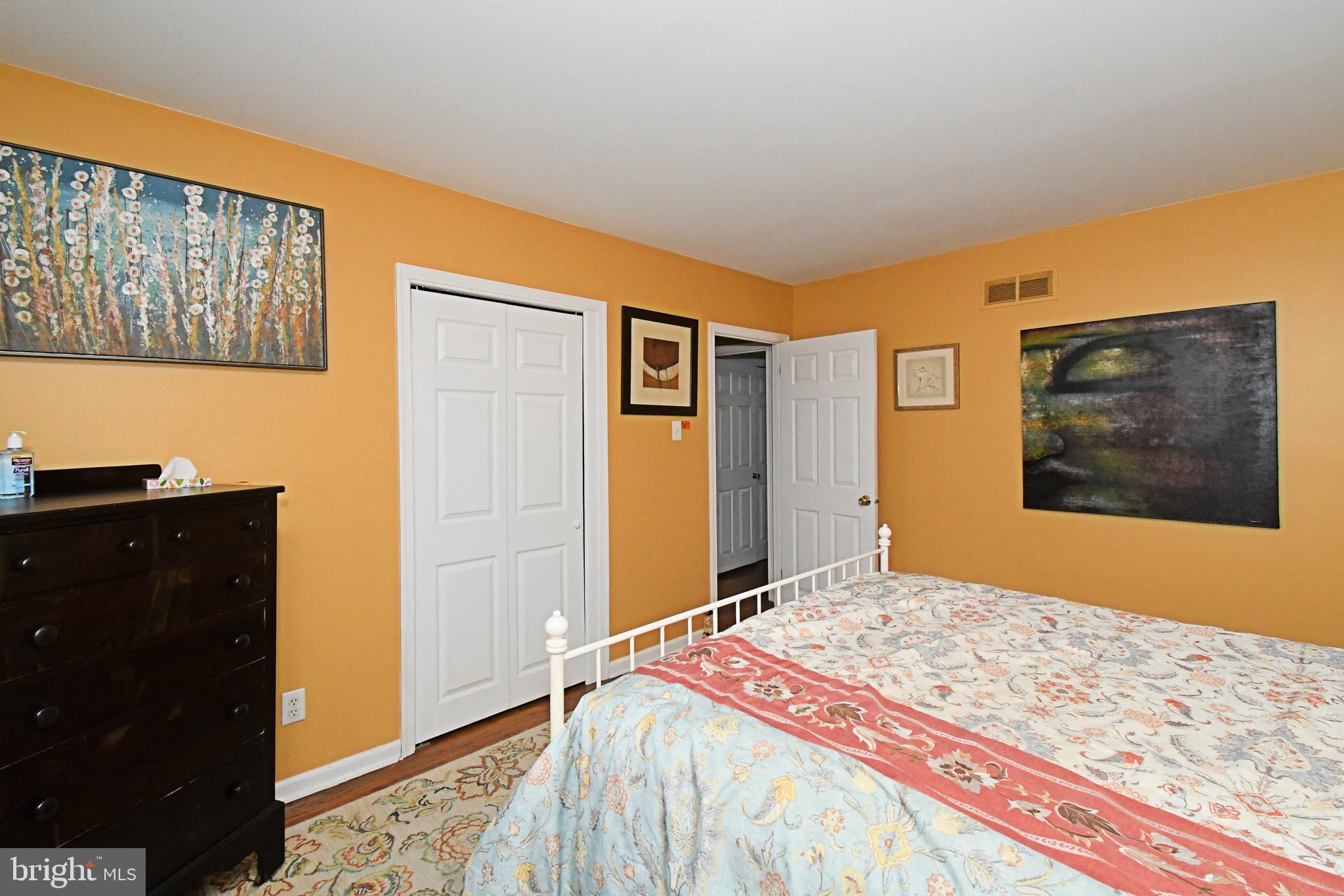 1113 Clark Road Wyndmoor, PA 19038 - Photo 38 of 68 a bedroom with a bed and a painting on the wall