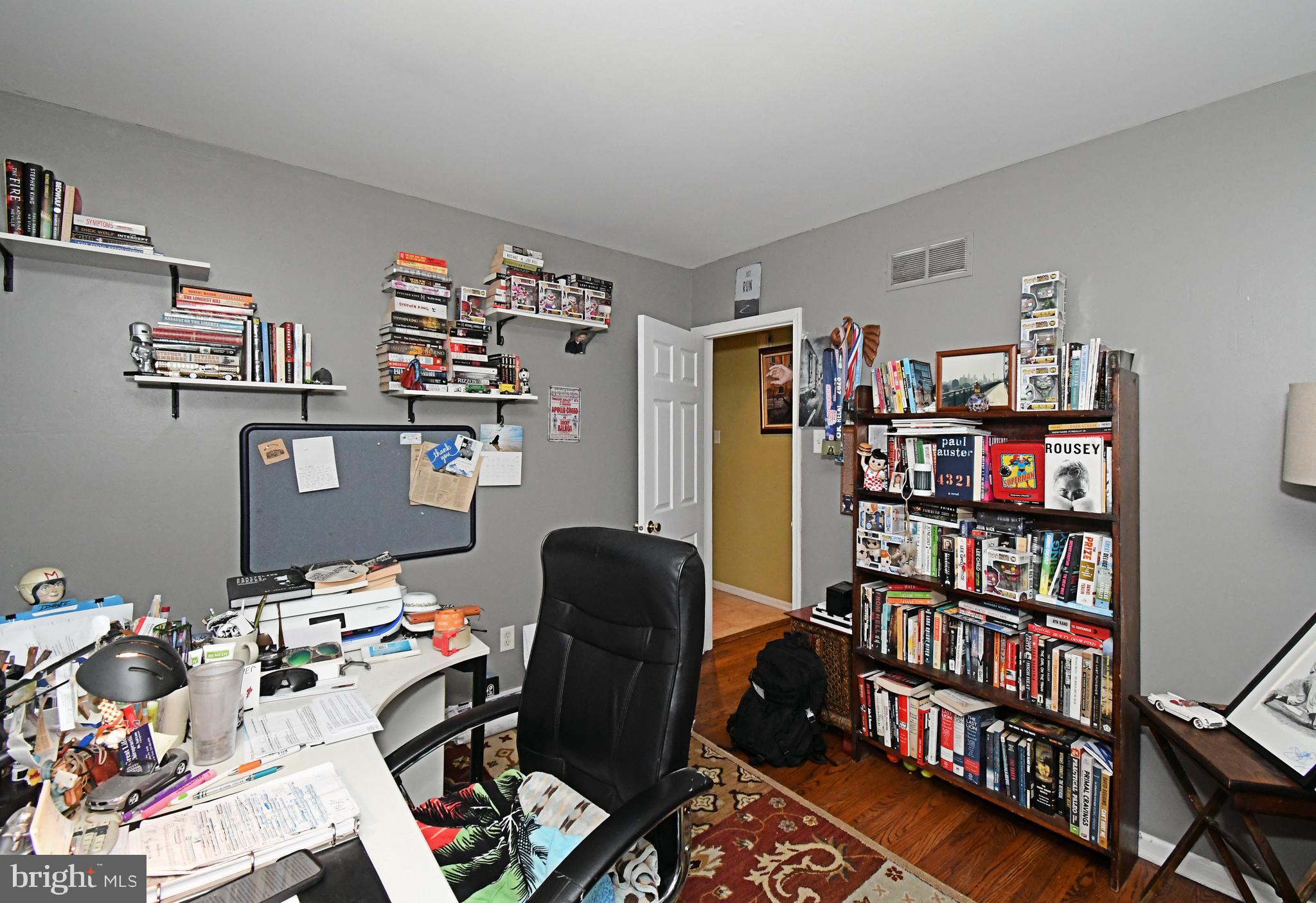1113 Clark Road Wyndmoor, PA 19038 - Photo 41 of 68 a view of a workspace with bookshelf and a window