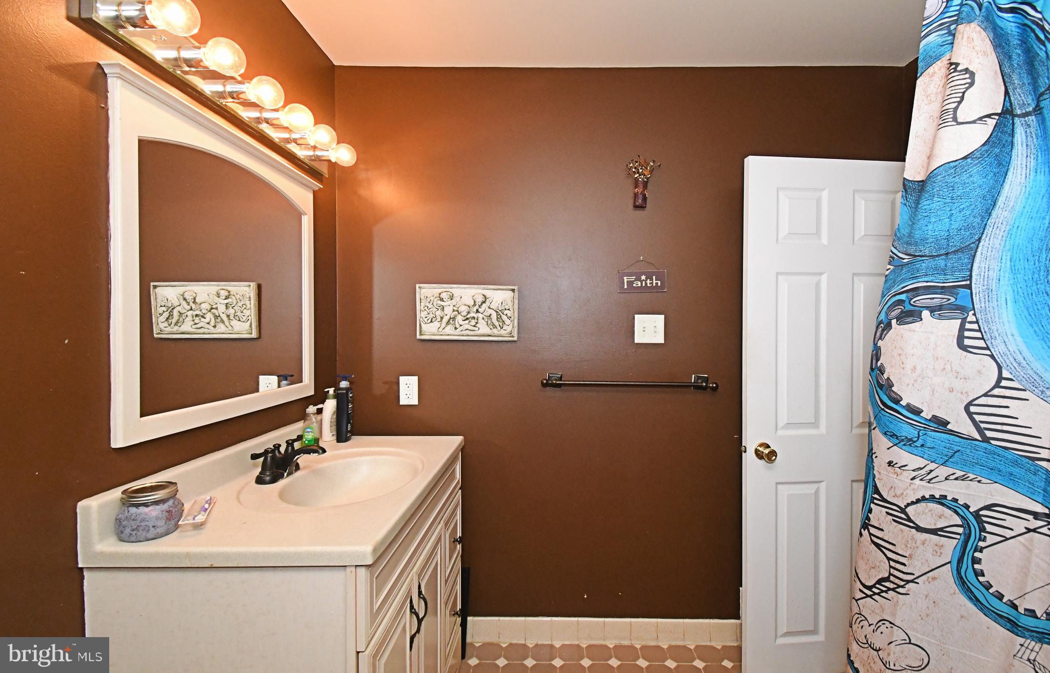 1113 Clark Road Wyndmoor, PA 19038 - Photo 44 of 68 a bathroom with a sink a toilet and shower