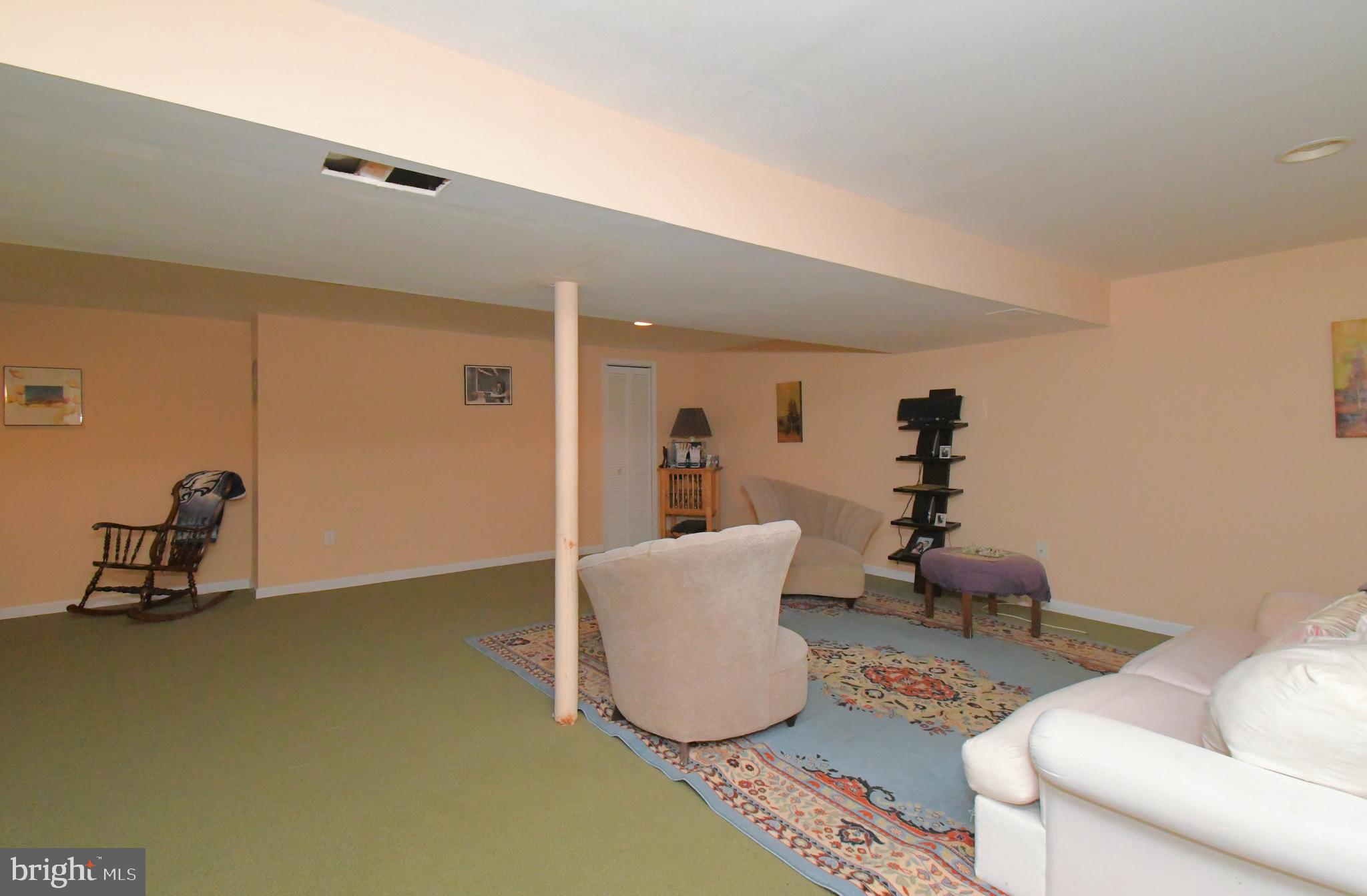 1113 Clark Road Wyndmoor, PA 19038 - Photo 50 of 68 a living room with furniture and a wooden floor