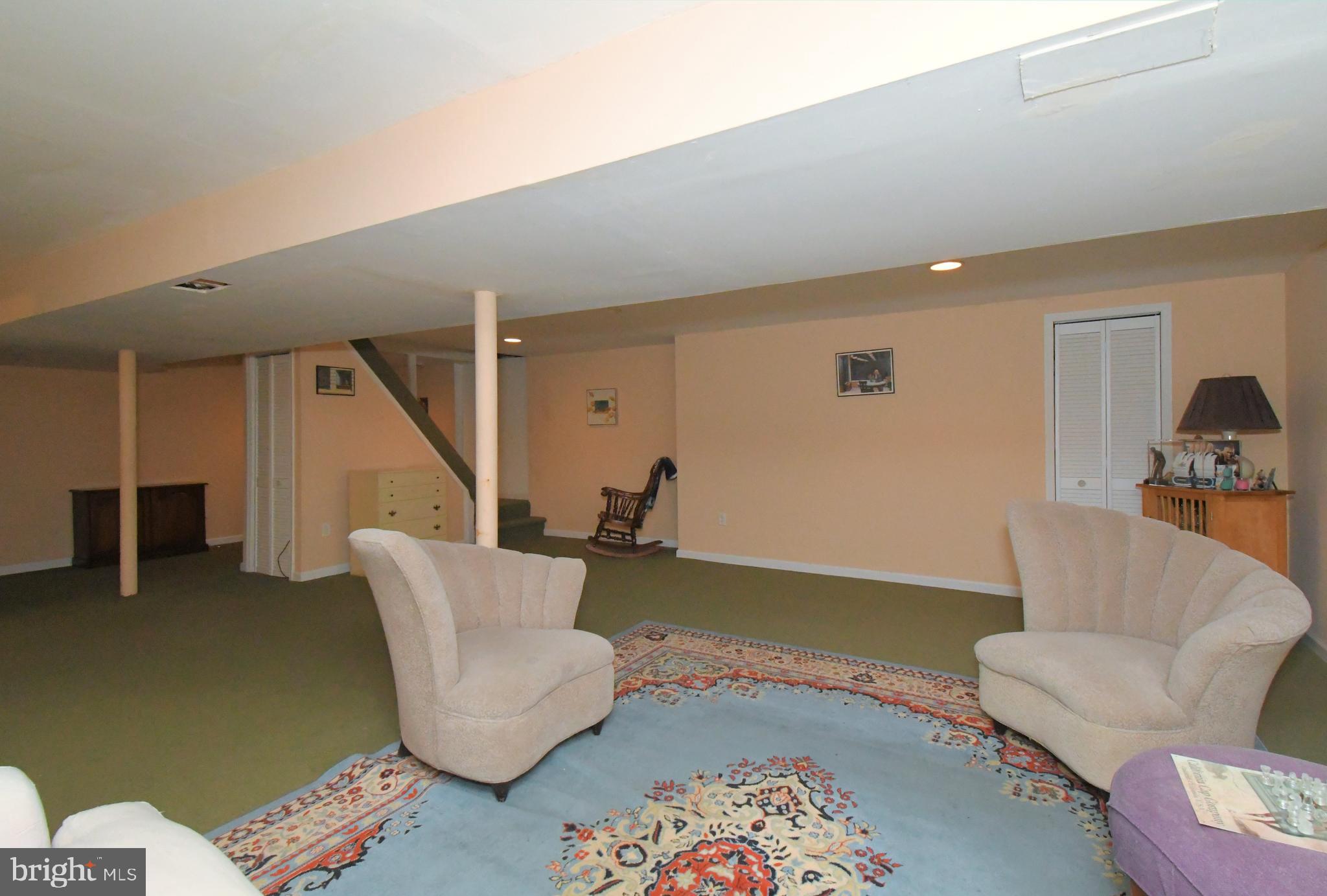 1113 Clark Road Wyndmoor, PA 19038 - Photo 52 of 68 a living room with furniture and stairs