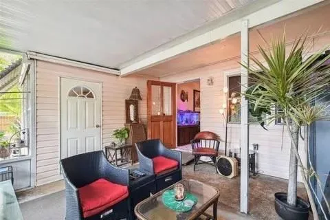 a living room with furniture ceiling fan and a rug