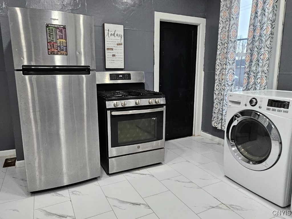 515 Henry Street Utica, NY 13502 - Photo 3 of 30 1st Floor - Kitchen Stove and Refrigerator