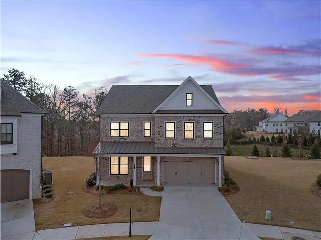 an aerial view of a house with outdoor space swimming pool