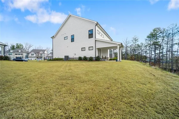 a view of a house with a yard