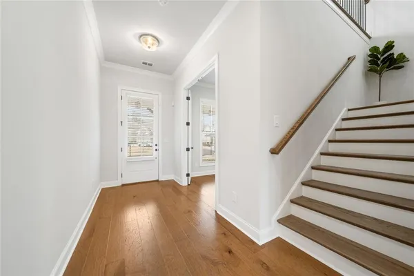 a view of entryway with wooden floor