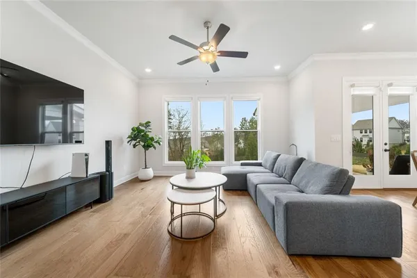 a living room with furniture and a large window
