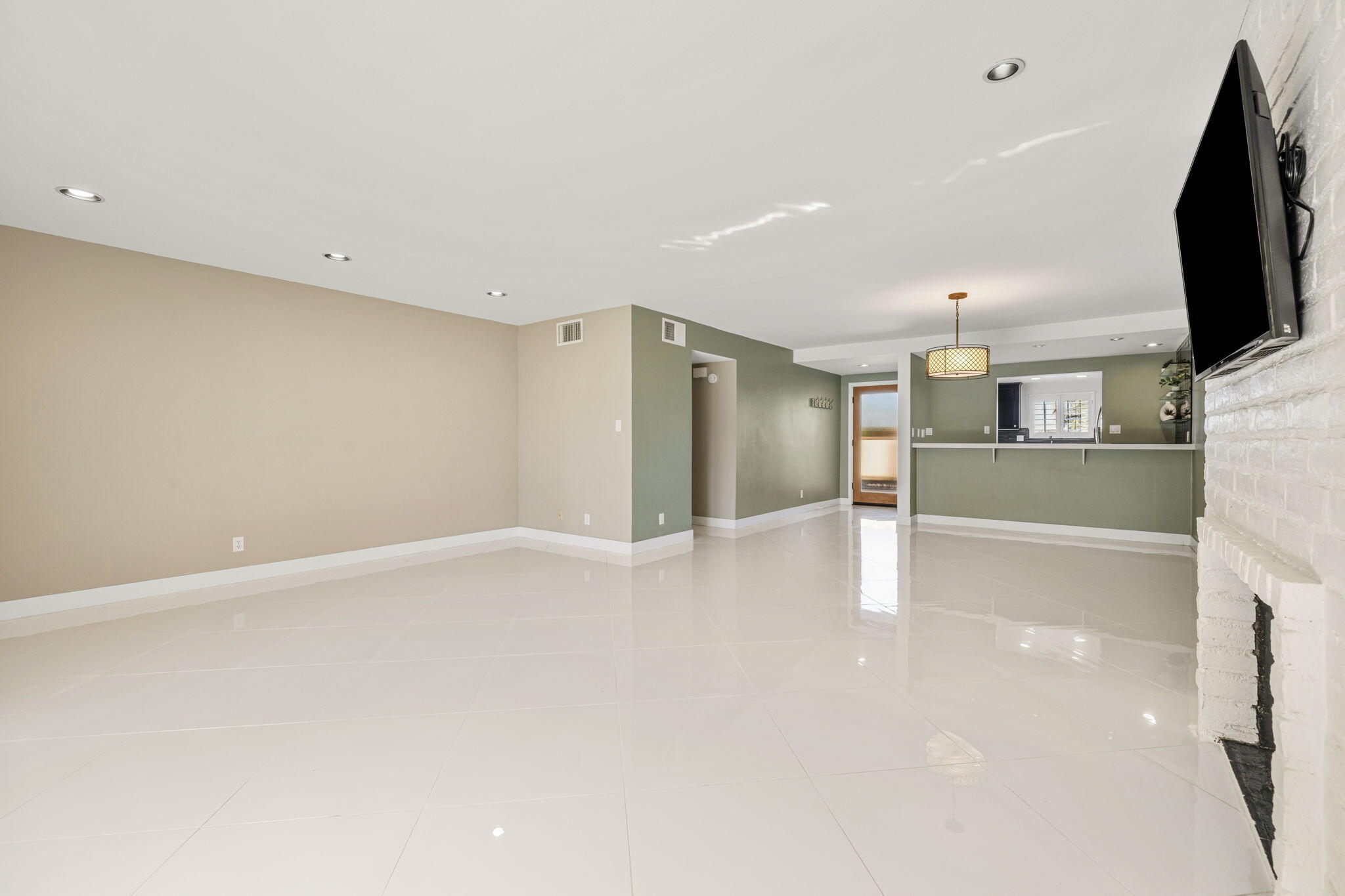 72915 Homestead Road Palm Desert, CA 92260 - Photo 14 of 45 a view of a kitchen with a refrigerator a microwave and a sink