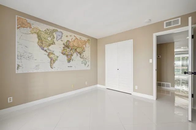 wooden floor in a empty room with a window