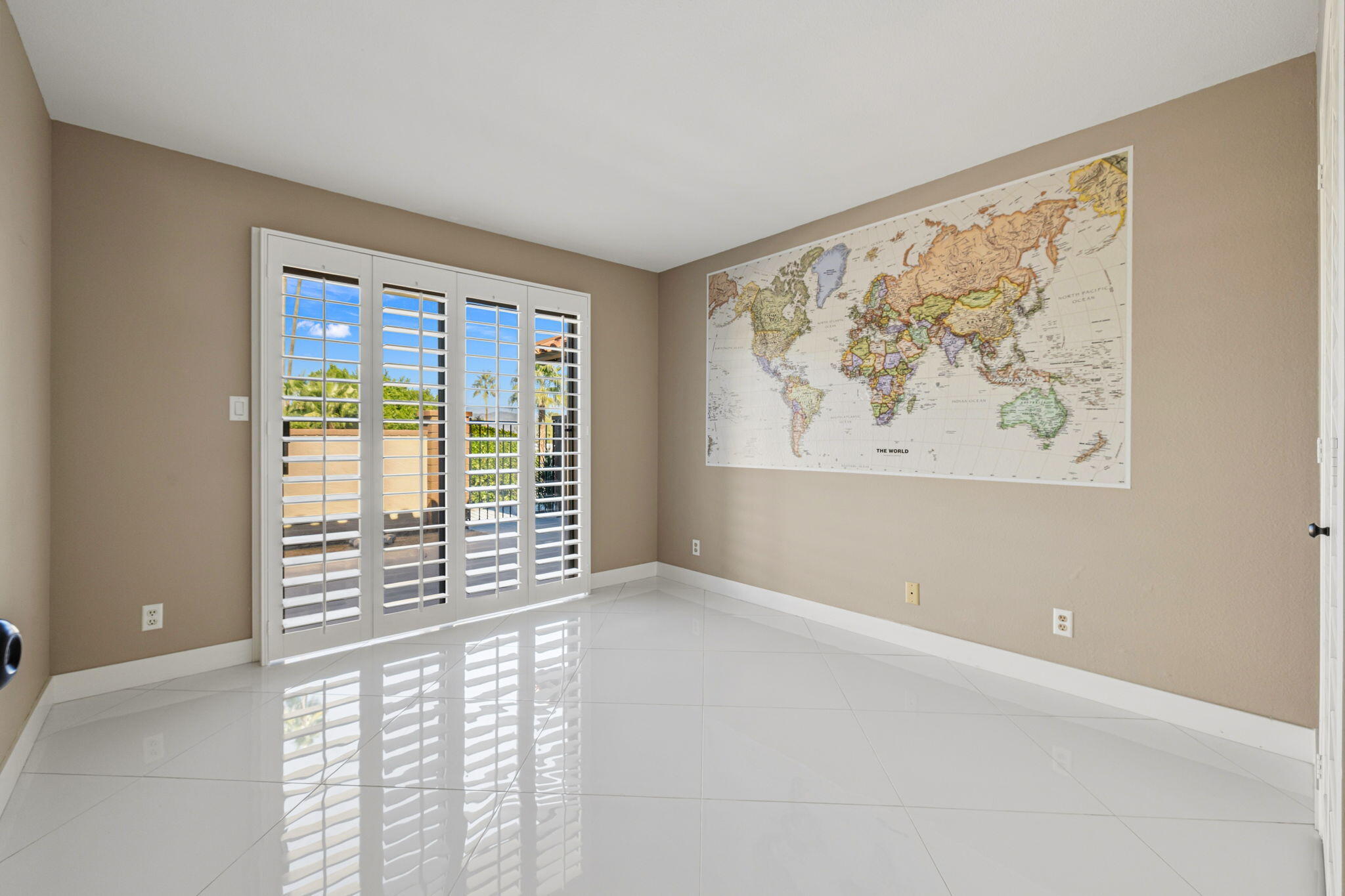 72915 Homestead Road Palm Desert, CA 92260 - Photo 16 of 45 wooden floor in an empty room with a window