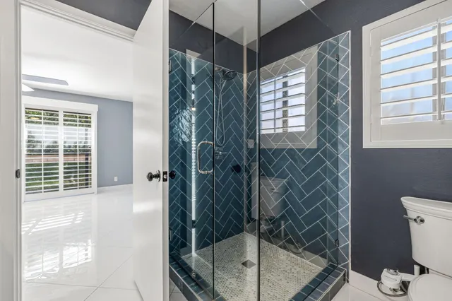 a bathroom with a shower and a tub