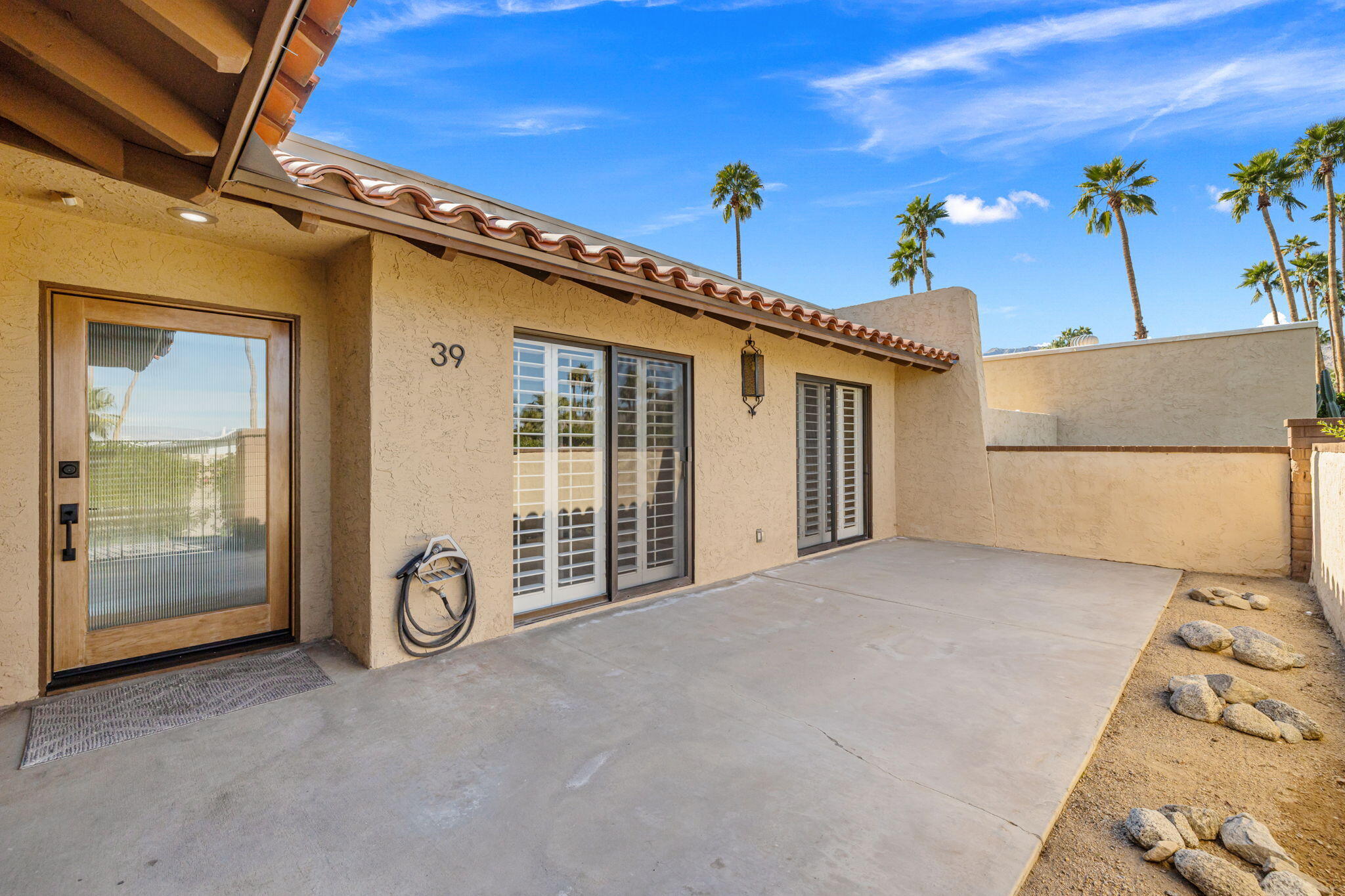 72915 Homestead Road Palm Desert, CA 92260 - Photo 30 of 45 a view of a house with a garage