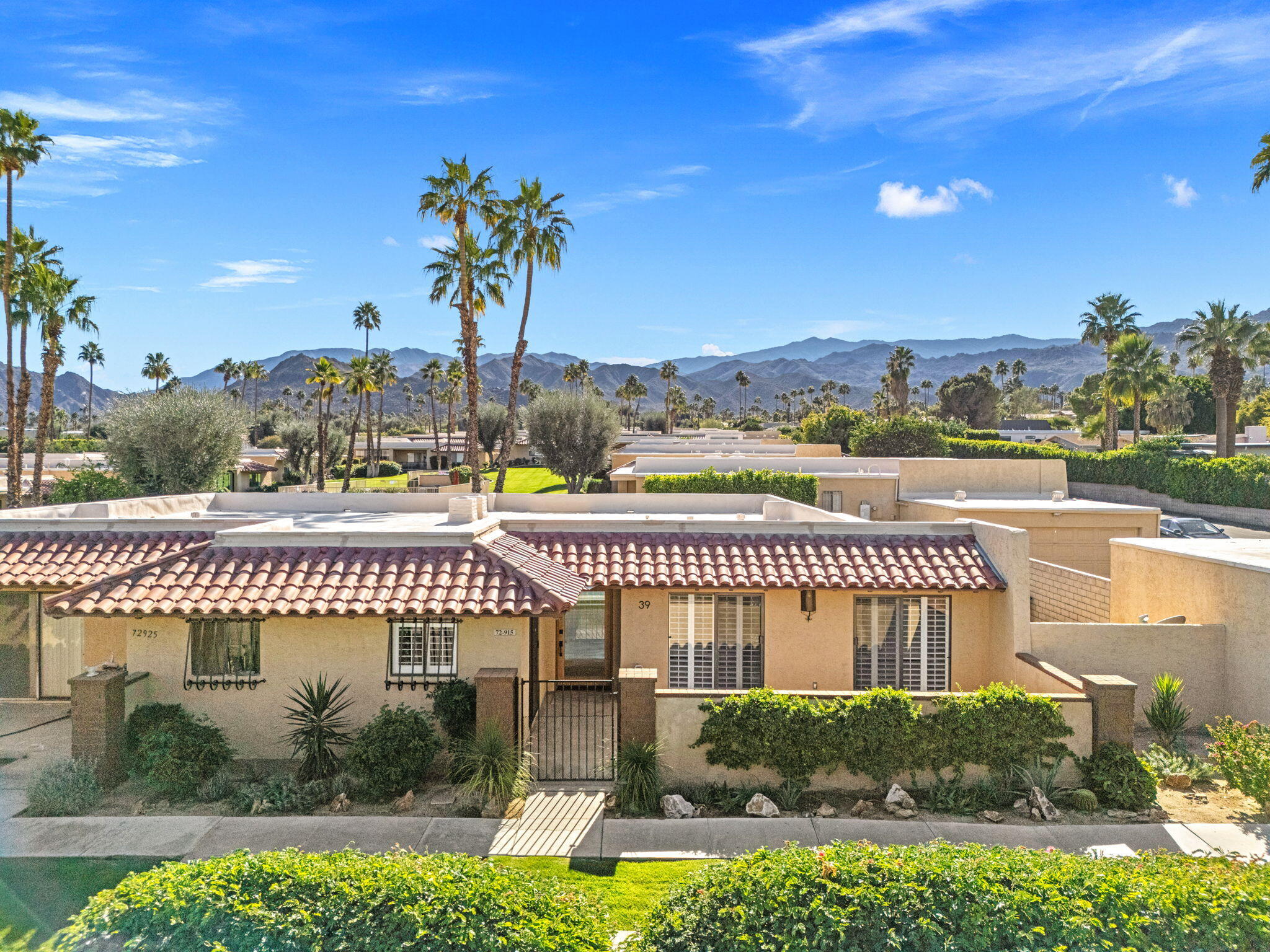 72915 Homestead Road Palm Desert, CA 92260 - Photo 40 of 45 a view of a swimming pool with an outdoor space and seating area