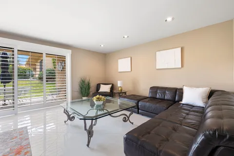 a white bath tub sitting next to a white toilet