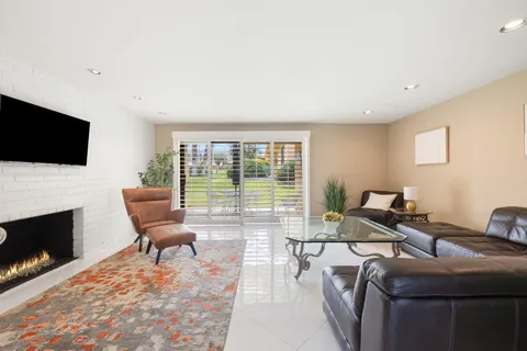 a bathroom with a granite countertop sink and mirror