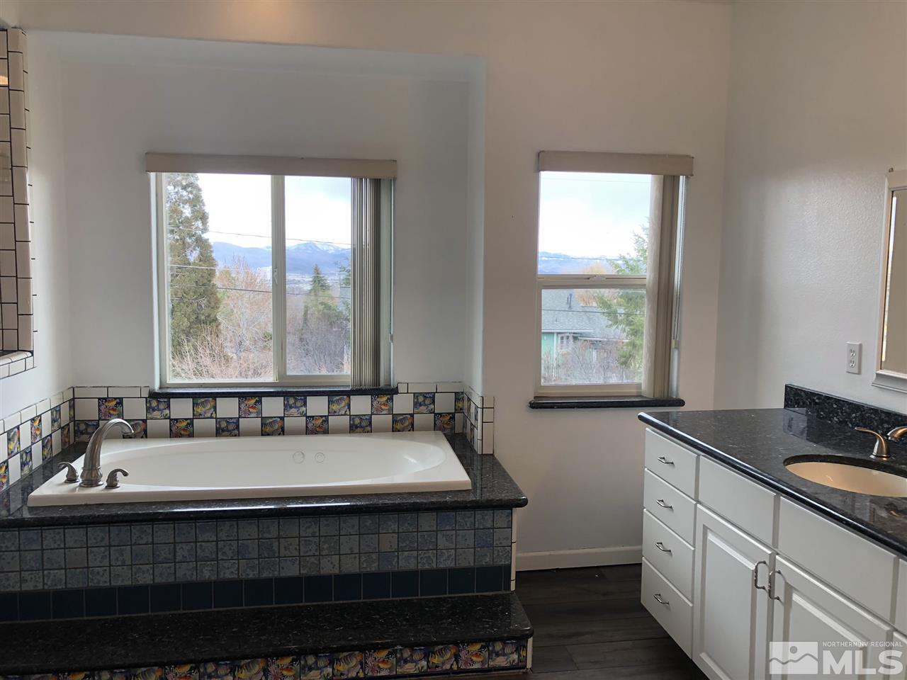170 Redstone Drive Reno, NV 89512 - Photo 11 of 17 a bathroom with a bathtub and a sink