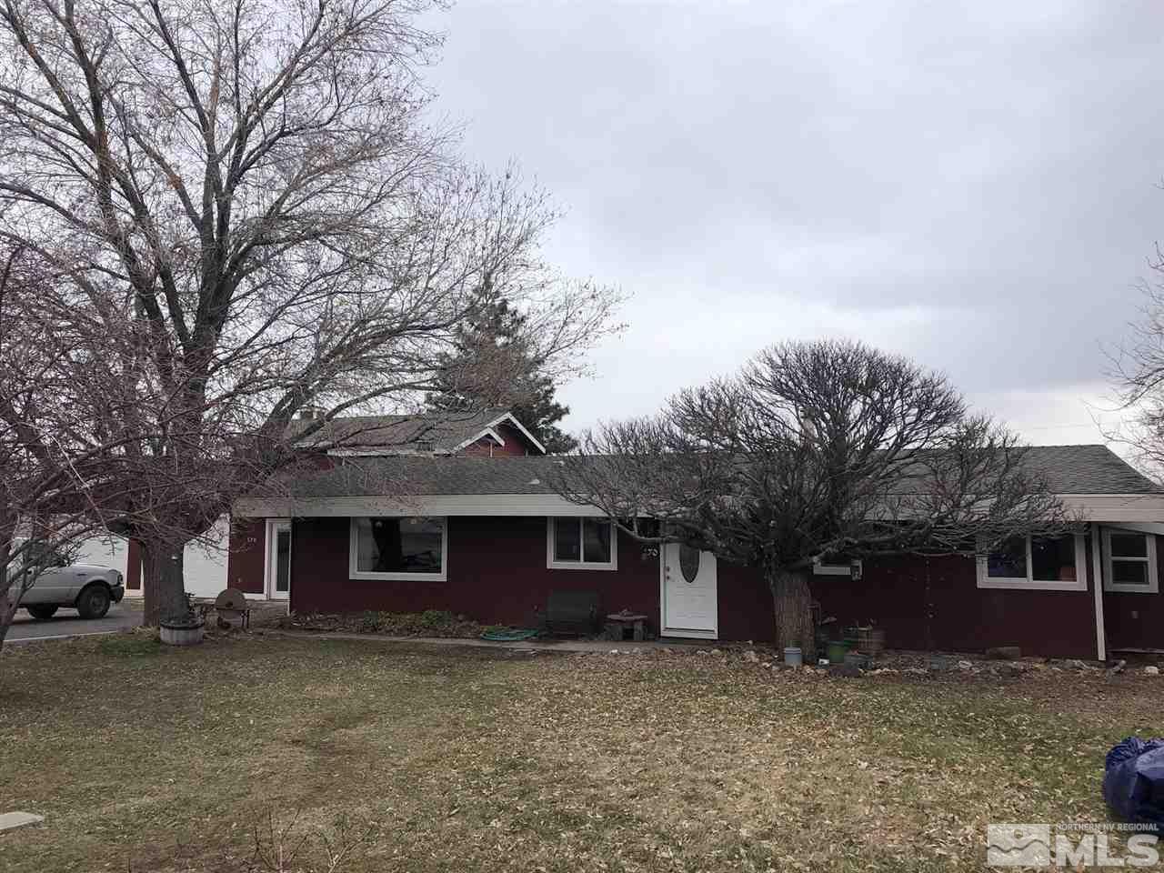 170 Redstone Drive Reno, NV 89512 - Photo 3 of 17 a front view of a house with a garden