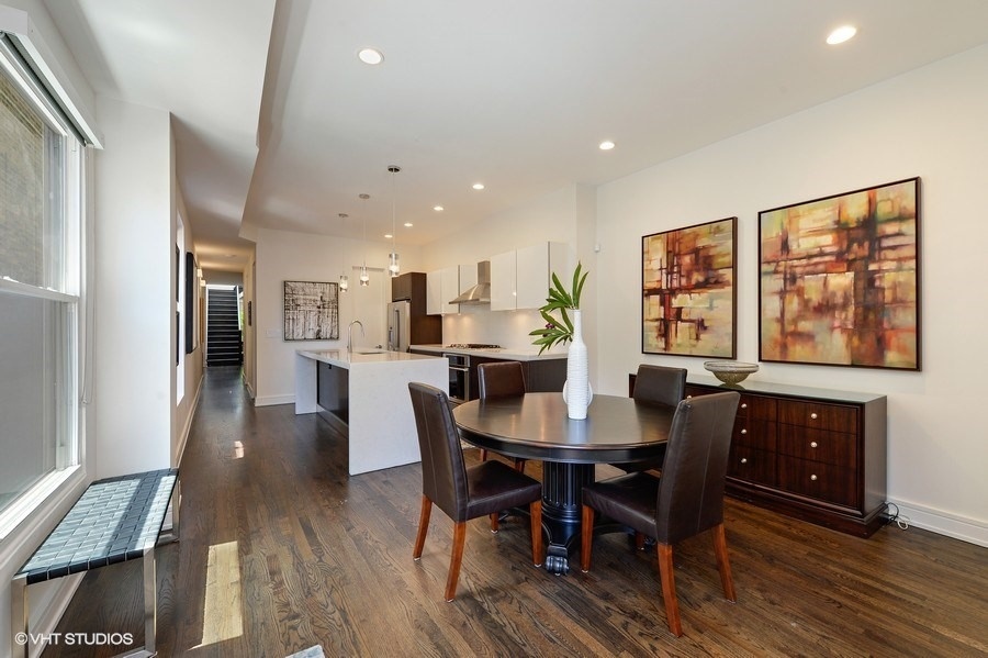 1439 North Dearborn Street, Unit 2 Chicago, IL 60610 - Photo 7 of 18 a view of a dining room with furniture window and wooden floor