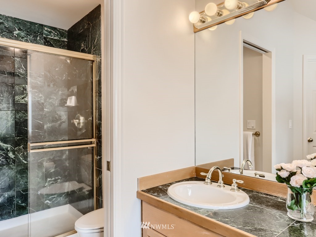 3007 215th Street Southeast Bothell, WA 98021 - Photo 21 of 28 a bathroom with a sink toilet and shower