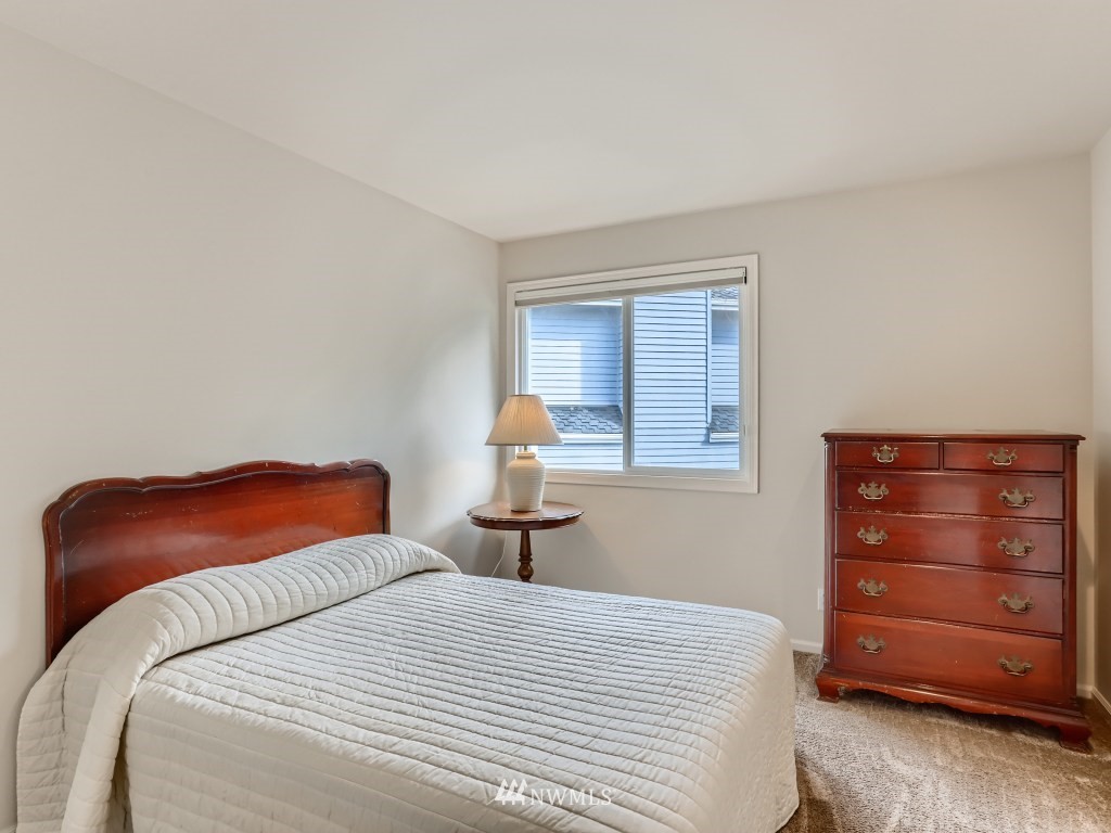 3007 215th Street Southeast Bothell, WA 98021 - Photo 22 of 28 a bedroom with a bed and a night stand