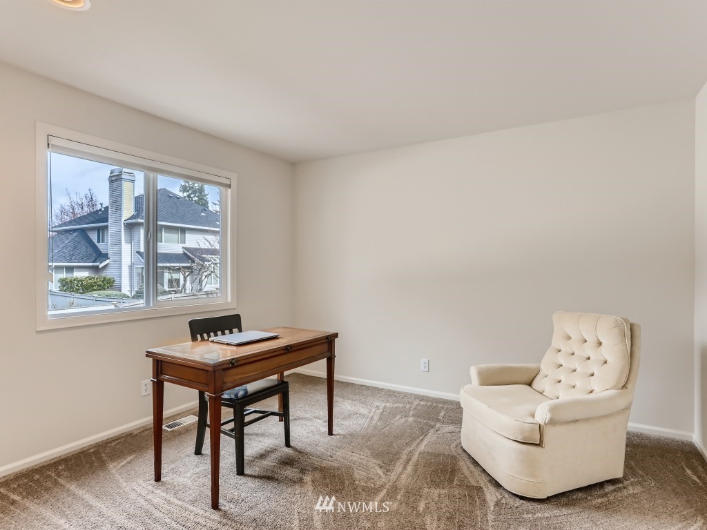 3007 215th Street Southeast Bothell, WA 98021 - Photo 23 of 28 a living room with furniture and a window