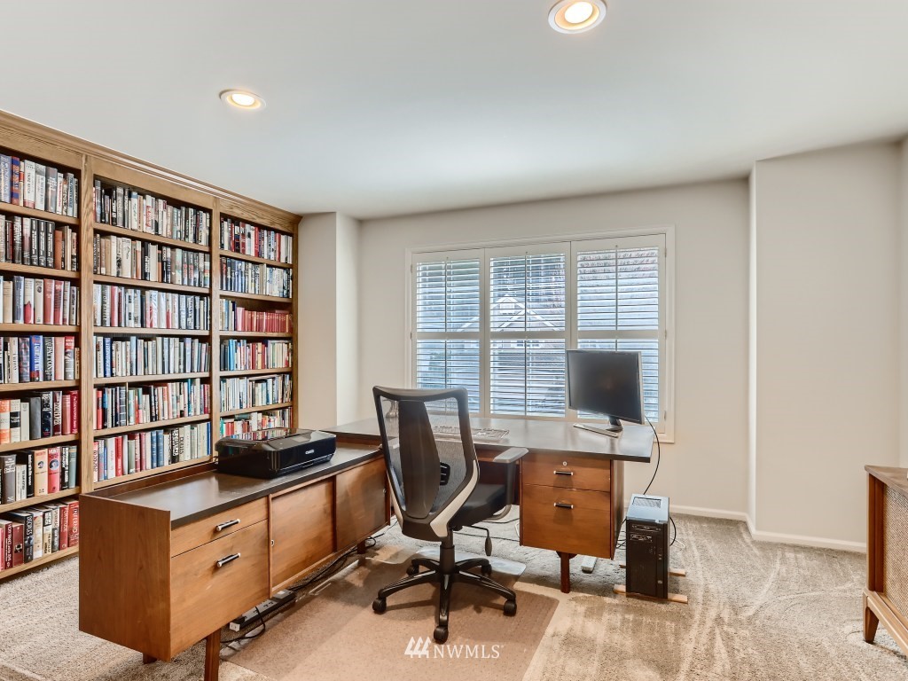 3007 215th Street Southeast Bothell, WA 98021 - Photo 24 of 28 a view of a workspace with furniture and a window