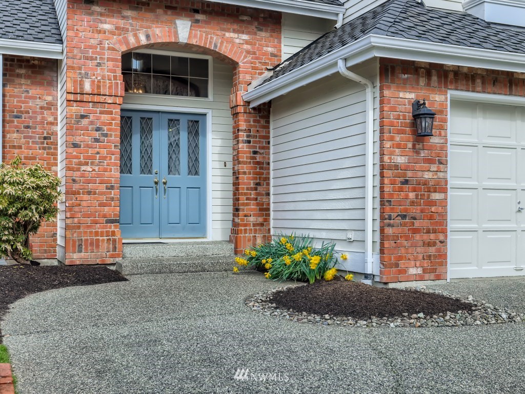 3007 215th Street Southeast Bothell, WA 98021 - Photo 3 of 28 a front view of a house with garden