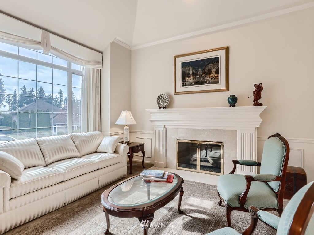 3007 215th Street Southeast Bothell, WA 98021 - Photo 8 of 28 a living room with furniture and a fireplace