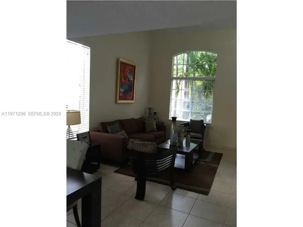 a living room with furniture and a window