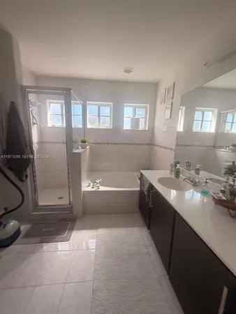a bathroom with a sink a toilet and tub