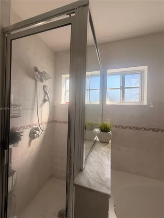 a view of a porch with furniture and shower