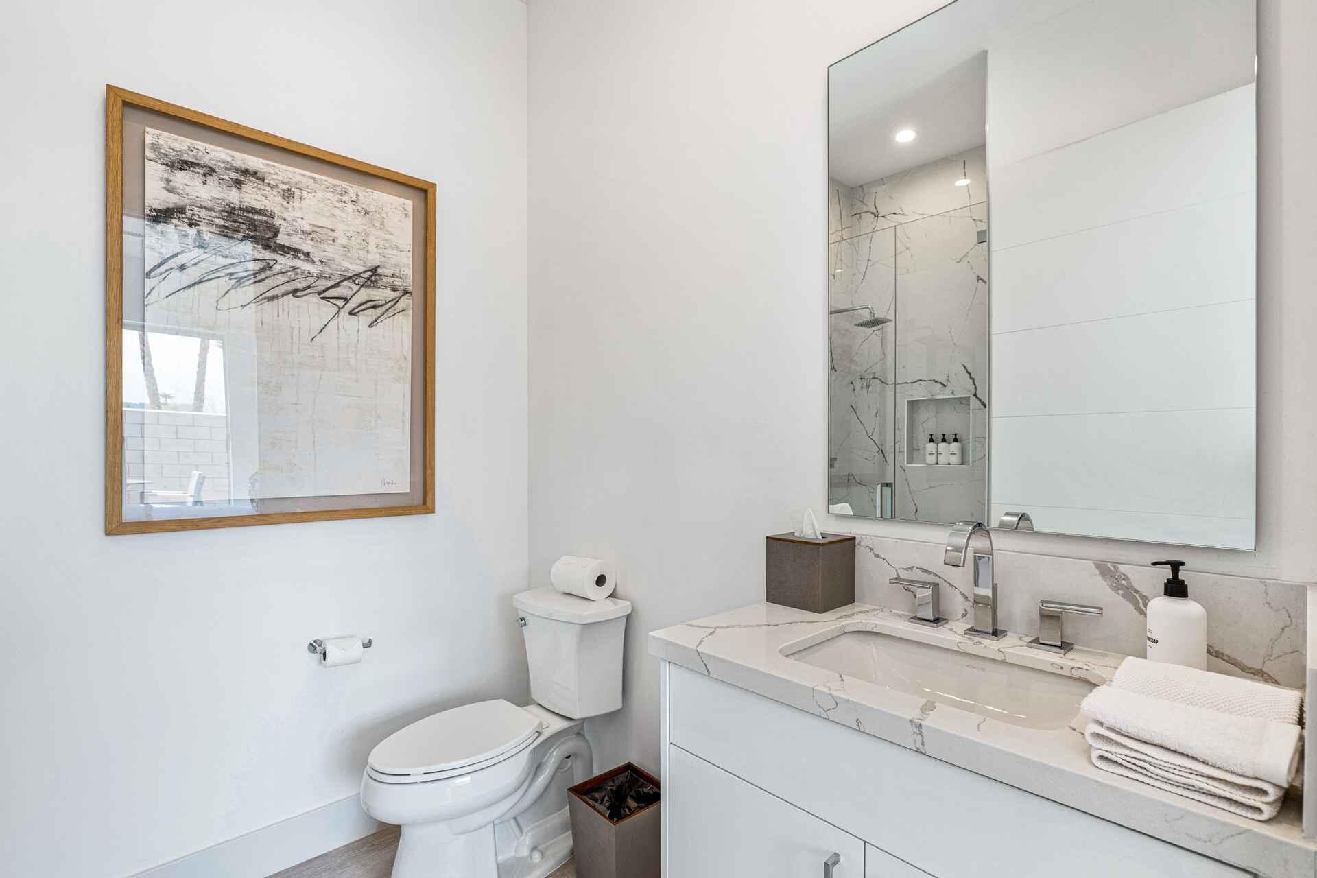 72985 Somera Road Palm Desert, CA 92260 - Photo 14 of 17 a bathroom with a toilet sink and mirror