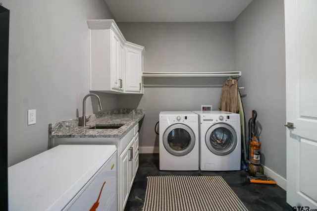 a utility room with dryer and washer