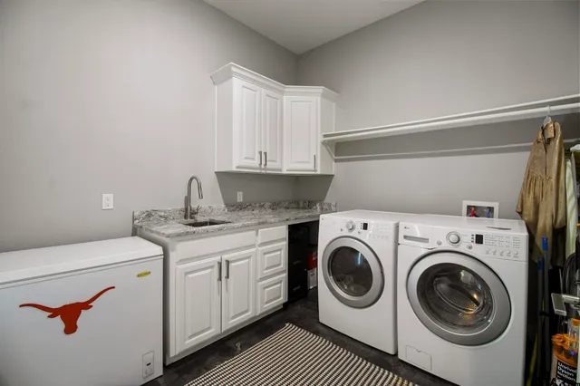a utility room with dryer and washer