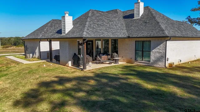 a view of a house with basketball court