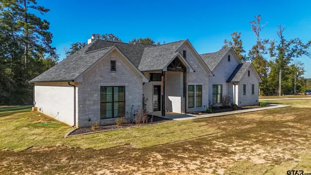 front view of a house with a yard