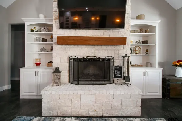 a kitchen with a cabinets and a fireplace
