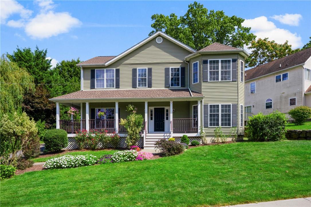 Picture perfect with a wrap around covered front porch!