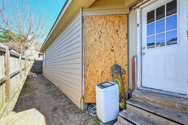 a view of a porch with wooden floor and stairs