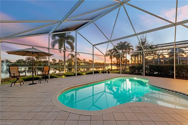 a view of a swimming pool with a patio